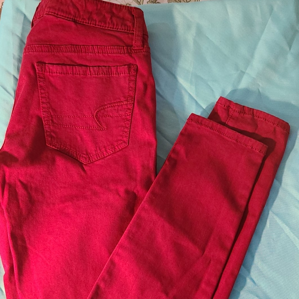 3/$25 AMERICAN EAGLE RED SKINNY JEANS 0 STRETCH